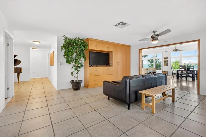 Designed for privacy, comfort, and connection, this open living space gives you the best of both worlds — a smart split floor plan with room to spread out, plus effortless flow into the heart of the home where Lake Dorr views steal the show.