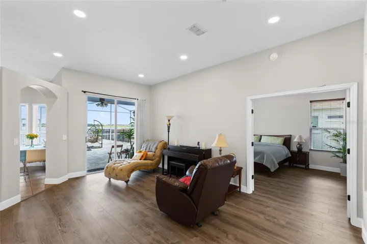 Living Room with View to Master Suite & Patio