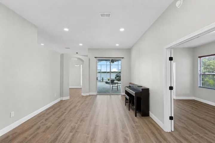 Foyer/Living Room with View to Master Suite & Patio