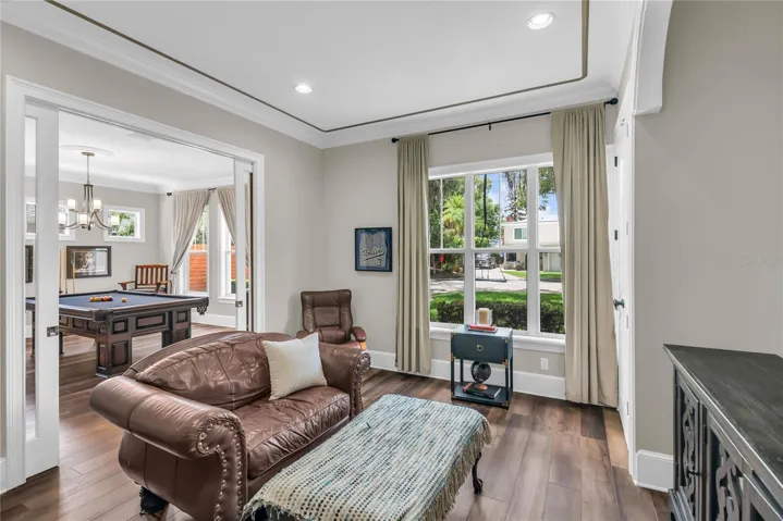 Downstairs office/den with sliding glass doors and 2 closets