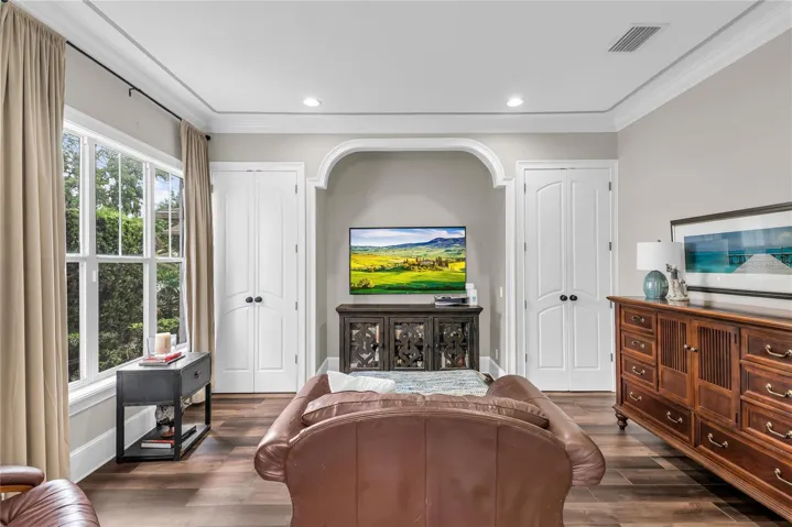 Downstairs office/den with sliding glass doors and 2 closets