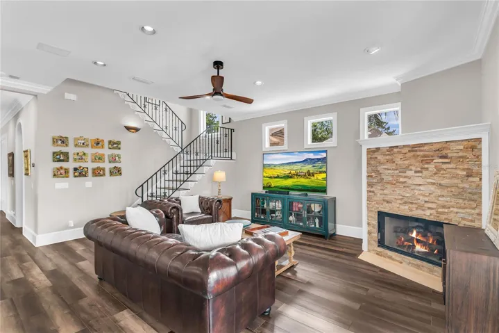 Family room with gas fireplace and French doors leading to the backporch and pool