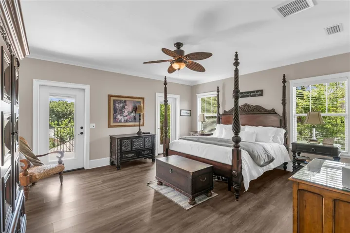 Huge primary suite with a walk-in closet plus an additional closet, private balcony overlooking the pool and spacious en suite bathroom