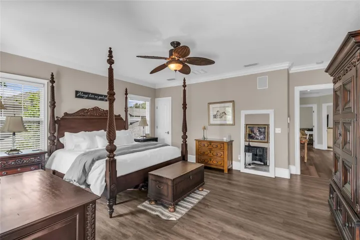 Huge primary suite with a walk-in closet plus an additional closet, private balcony overlooking the pool and spacious en suite bathroom