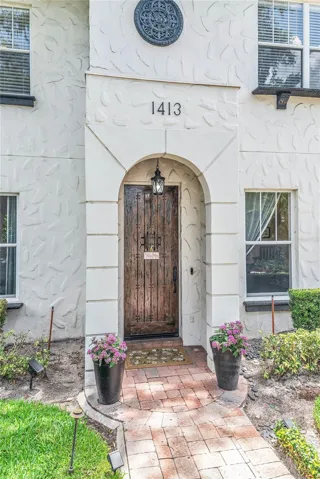 Charming entry with beautiful wood front door