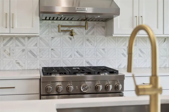 Pot filler and vented hood