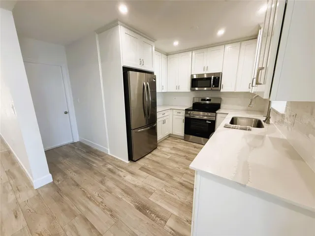 Kitchen and Entrance to the Garage, also where the Laundry is