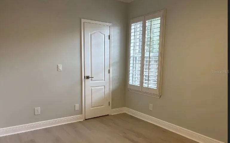 First floor bedroom with walk-in closet