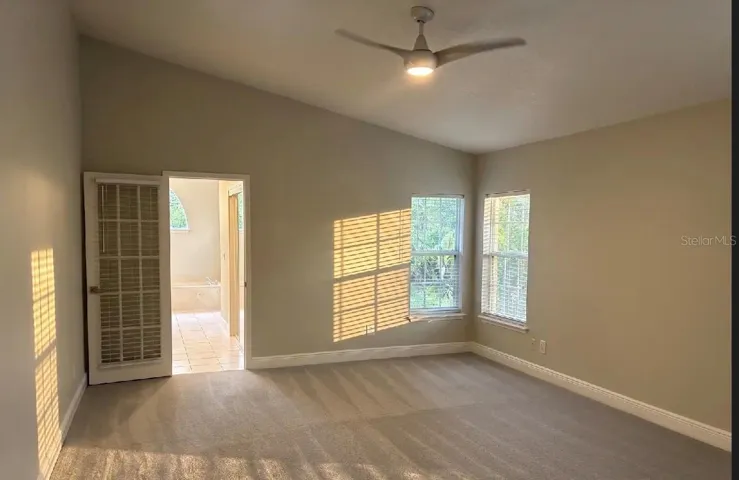 Master bedroom with walk-in closets and en-suite bathroom