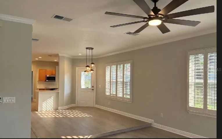 Dining room off or kitchen with situated hanging lamp