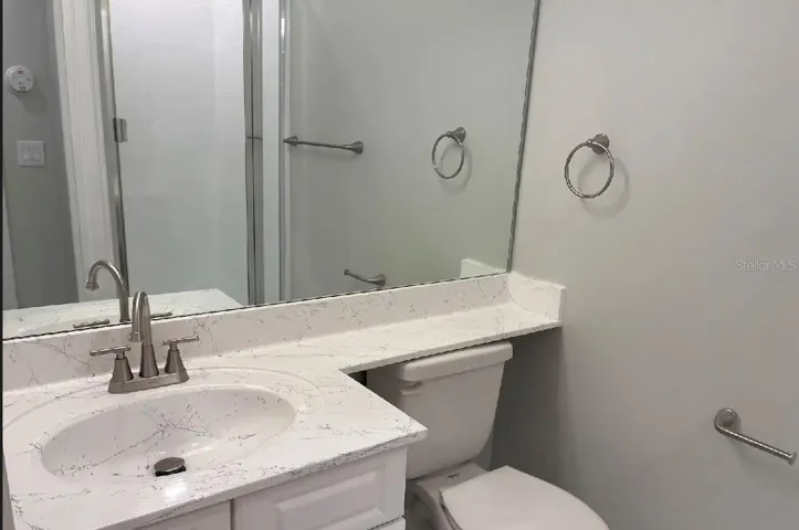 Downstairs full bathroom with shower- access to first floor bedroom