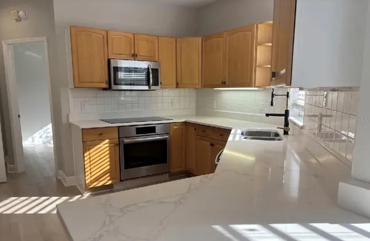 Quartz countertops throughout and stainless steel Bosch appliances