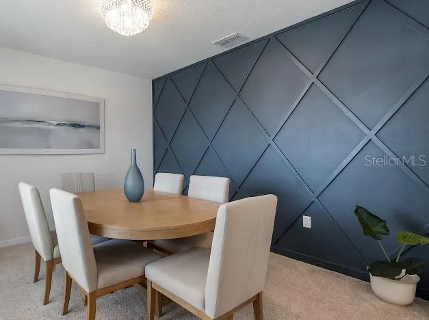 Front formal dining room with custom accent wall can be used as office - flex space