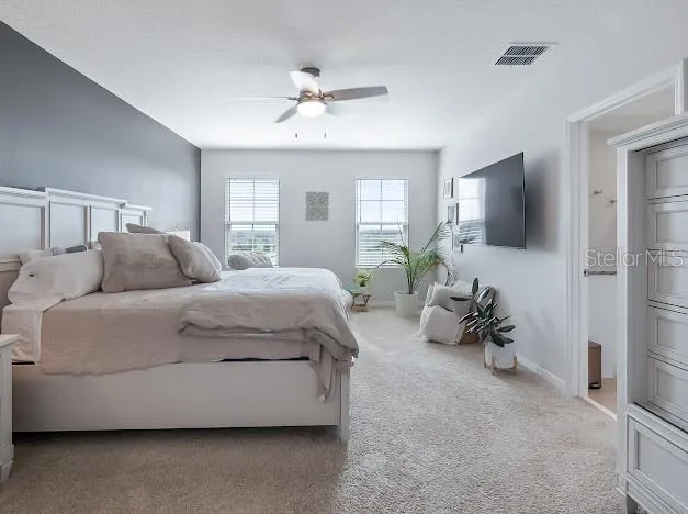 Primary bedroom en suite area which is oversized for sitting/office space, large walk in closet, great bathroom with walk in shower, double sinks and water closet