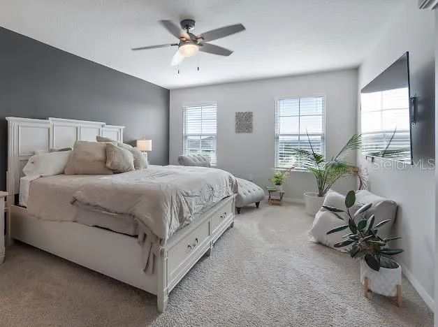 Primary bedroom en suite area which is oversized for sitting/office space, large walk in closet, great bathroom with walk in shower, double sinks and water closet
