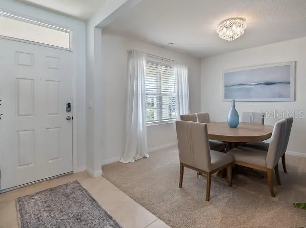 Front door foyer area to Front formal dining room with custom accent wall can be used as office - flex space