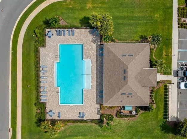 Aerial view of small community’s large pool and common area facilities.