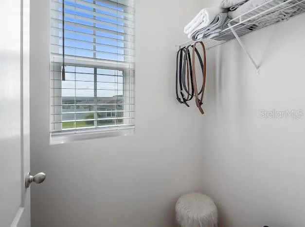 Primary bedroom en suite area which is oversized for sitting/office space, large walk in closet, great bathroom with walk in shower, double sinks and water closet