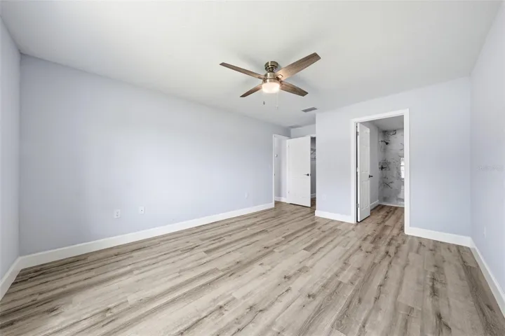 Additional view of the primary bedroom with plenty of natural light