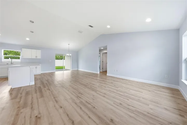 Expansive living space with modern finishes and direct access to the backyard patio