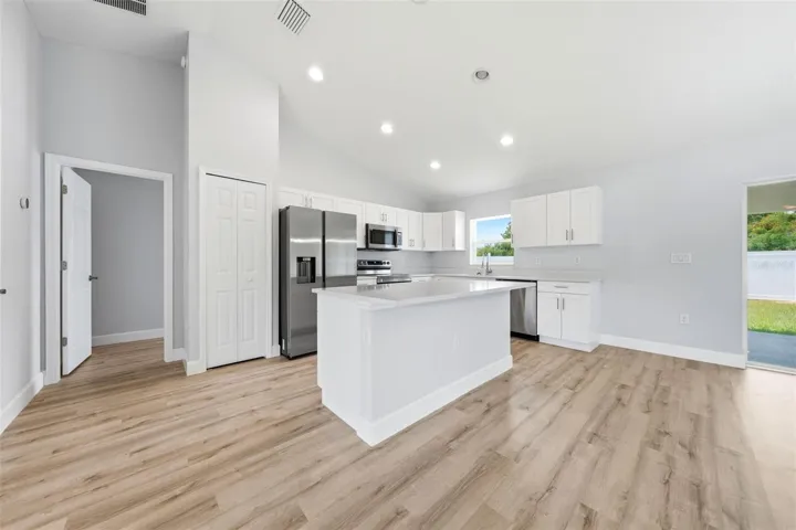 Large kitchen island overlooking the main living space