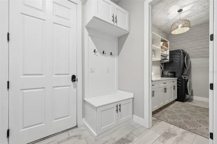garage entrance at end of hallways by laundry room