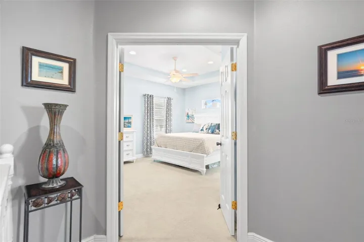 Double door entry to primary bedroom.