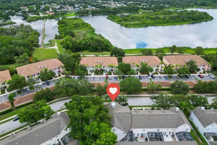 Aerial view showing the condos across the street and Manatee River behind.