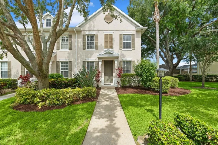 End unit with wide open side yard due to curve in the road.