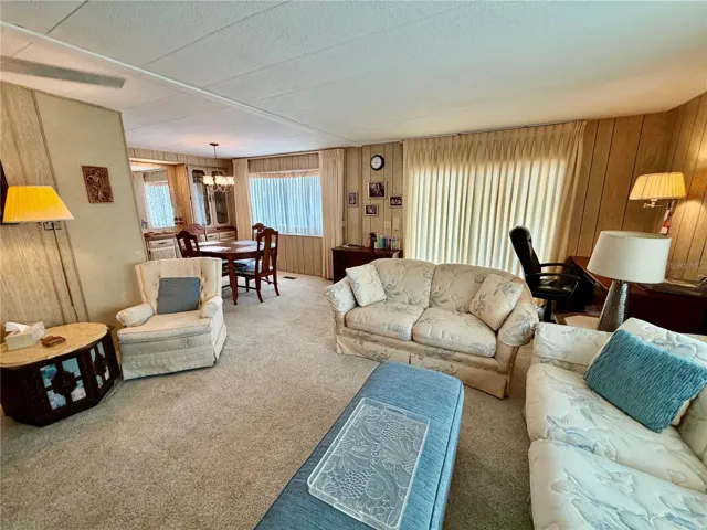 Sliding doors to the front porch behind the curtains