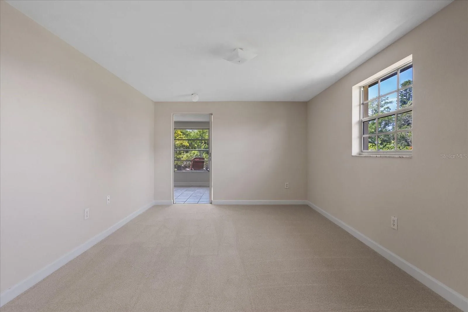 Primary bedroom with door to Lanai