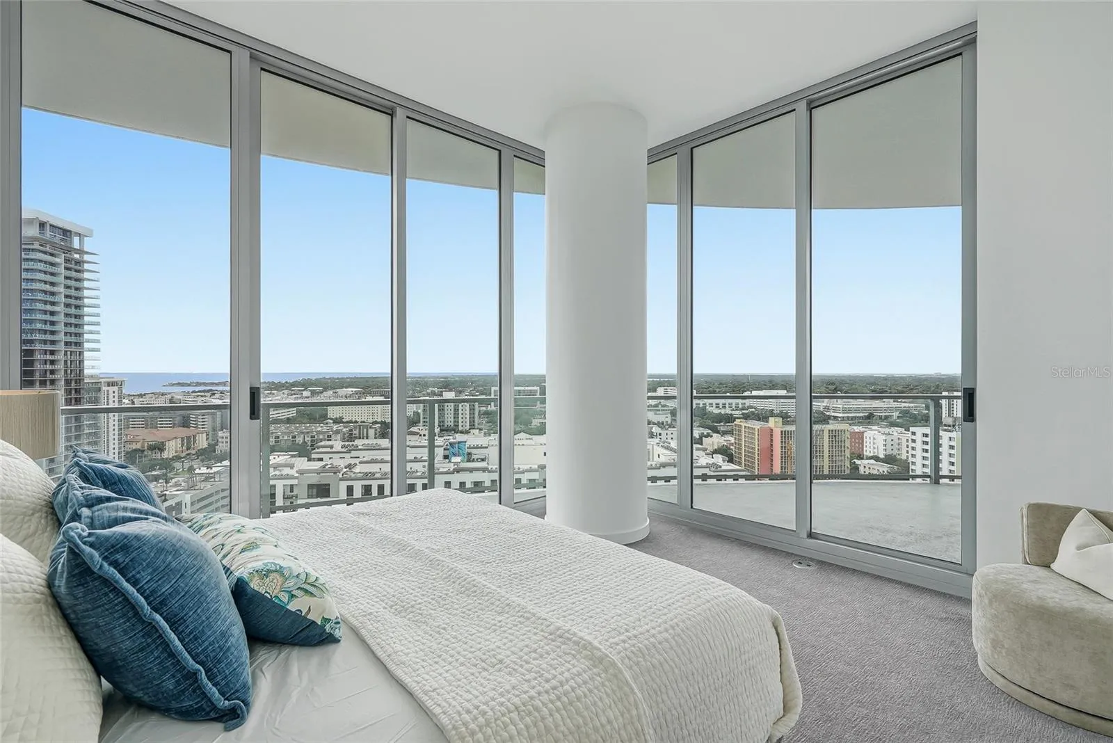 Spacious primary bedroom with a sitting area.