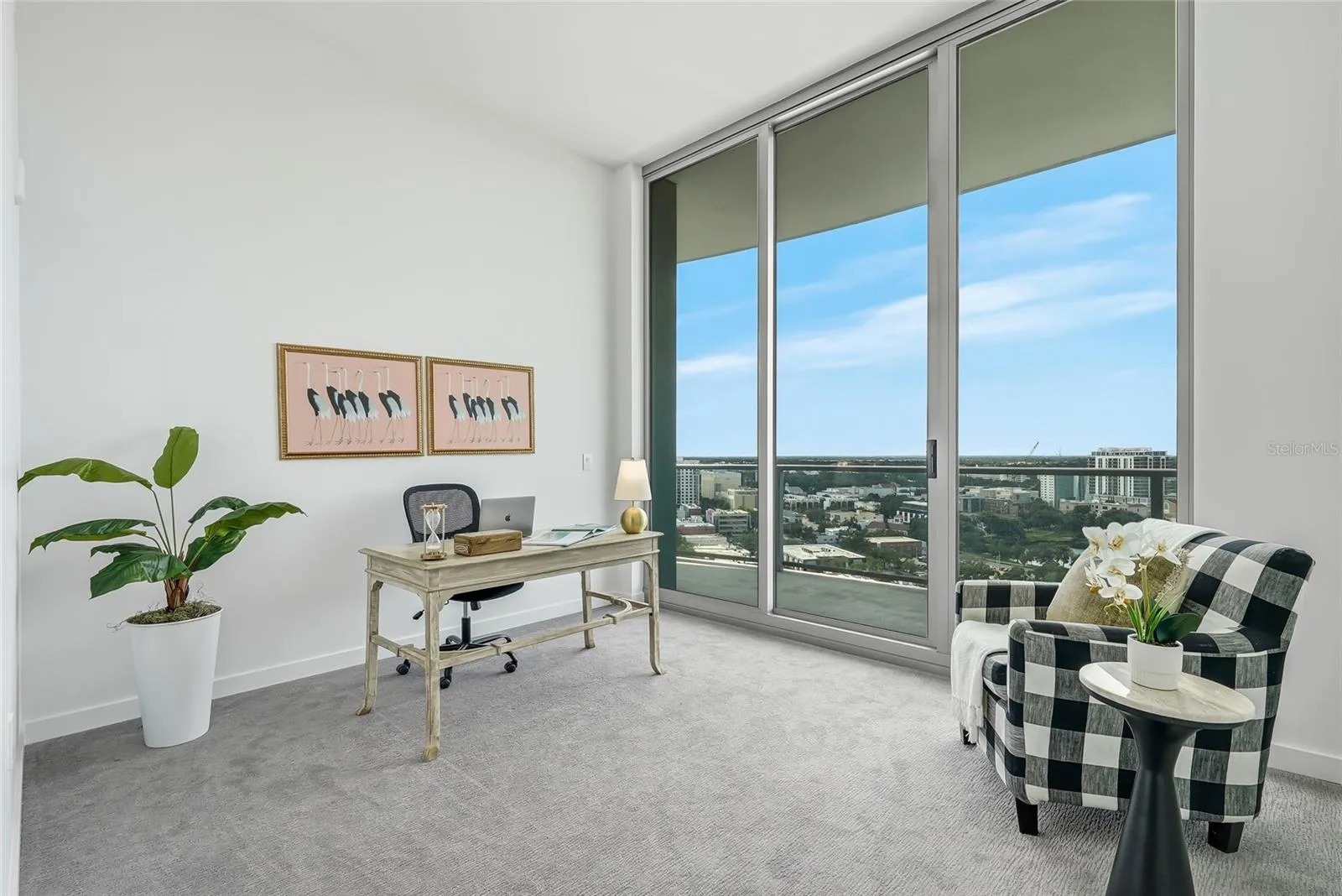 Guest room with private balcony access and north-facing views.