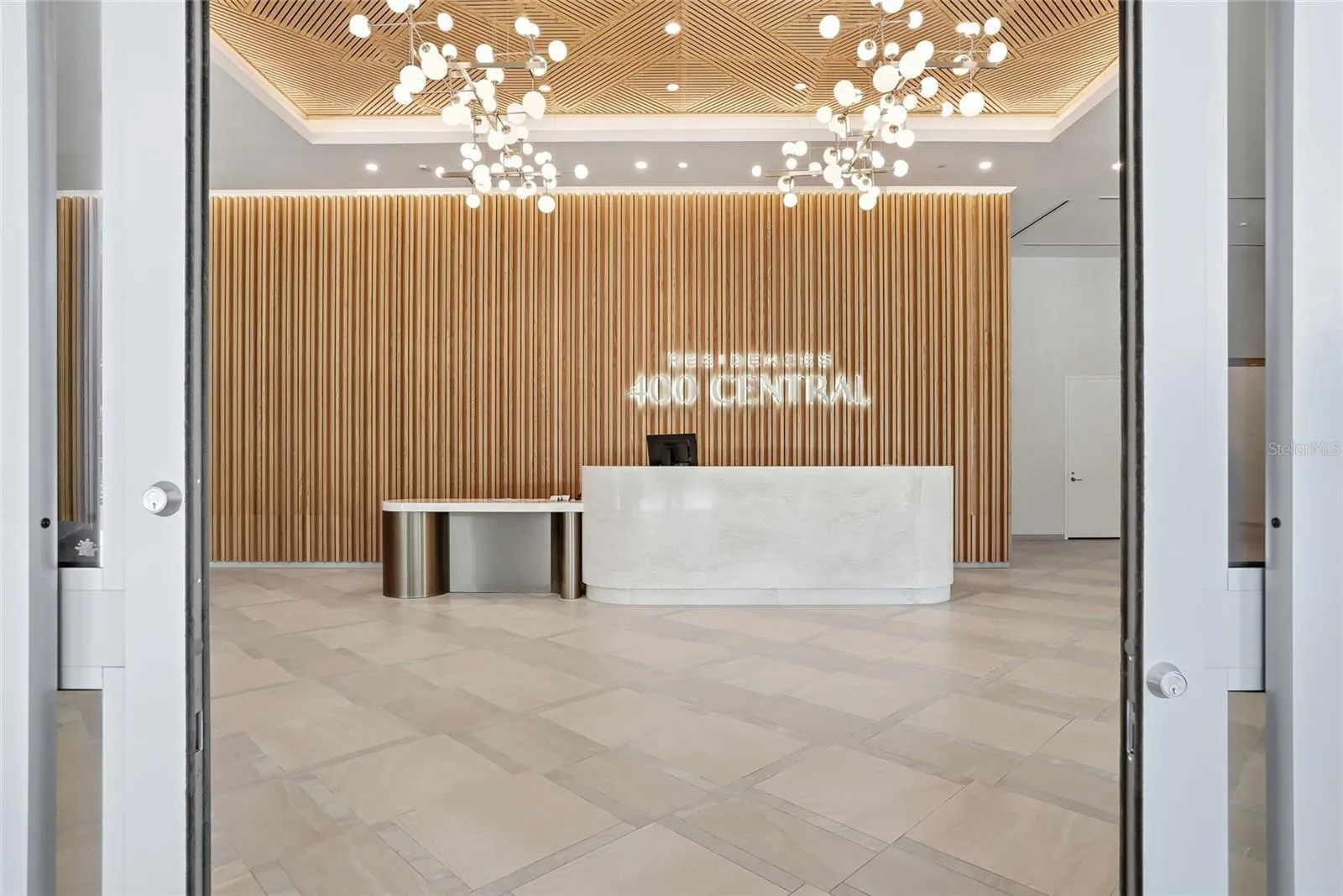 This is 400 Central's lobby with a welcoming 24-hour front desk staff.