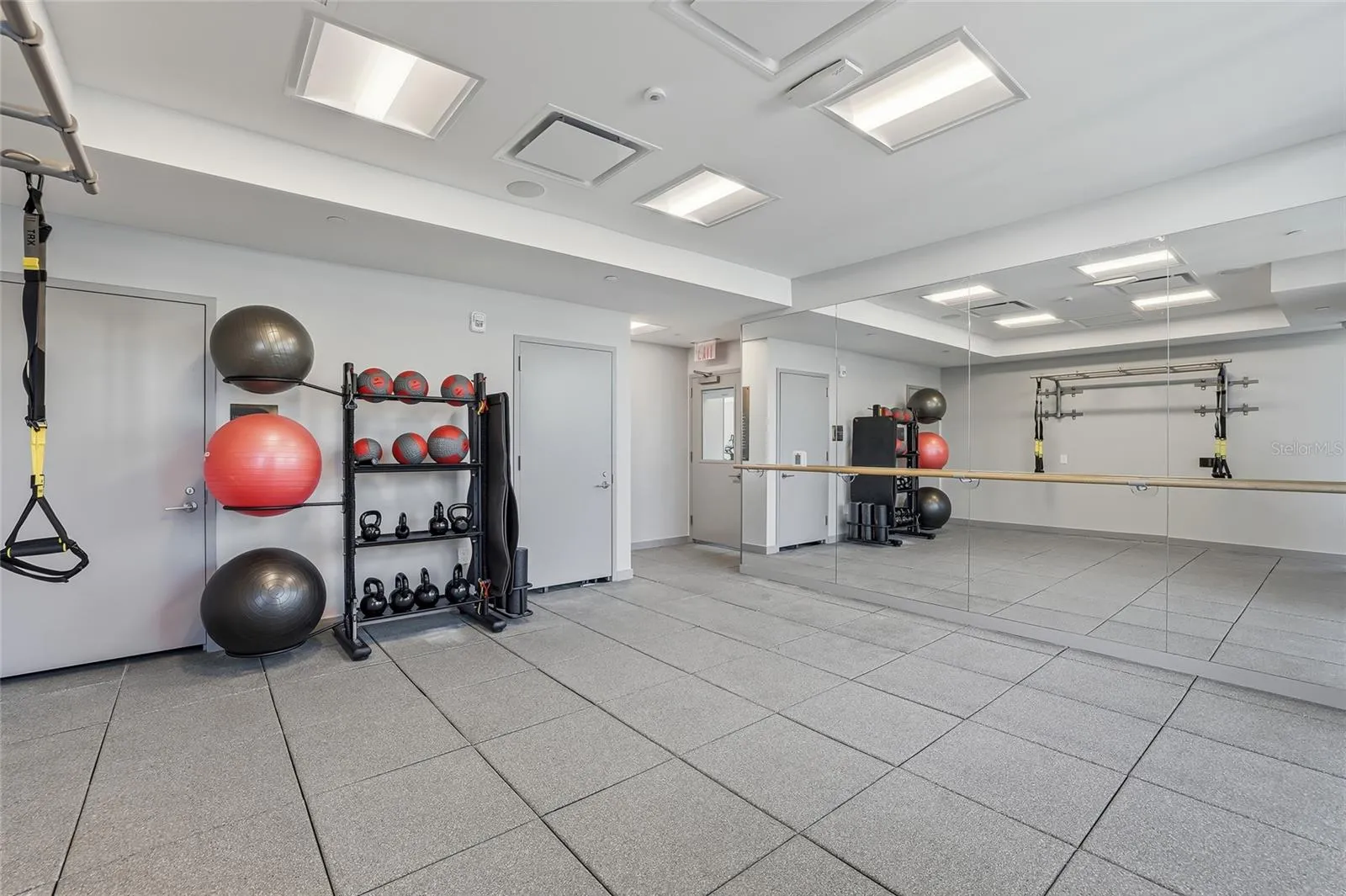 Well equipped fitness studio for yoga, Pilates, stretching, and fitness classes.