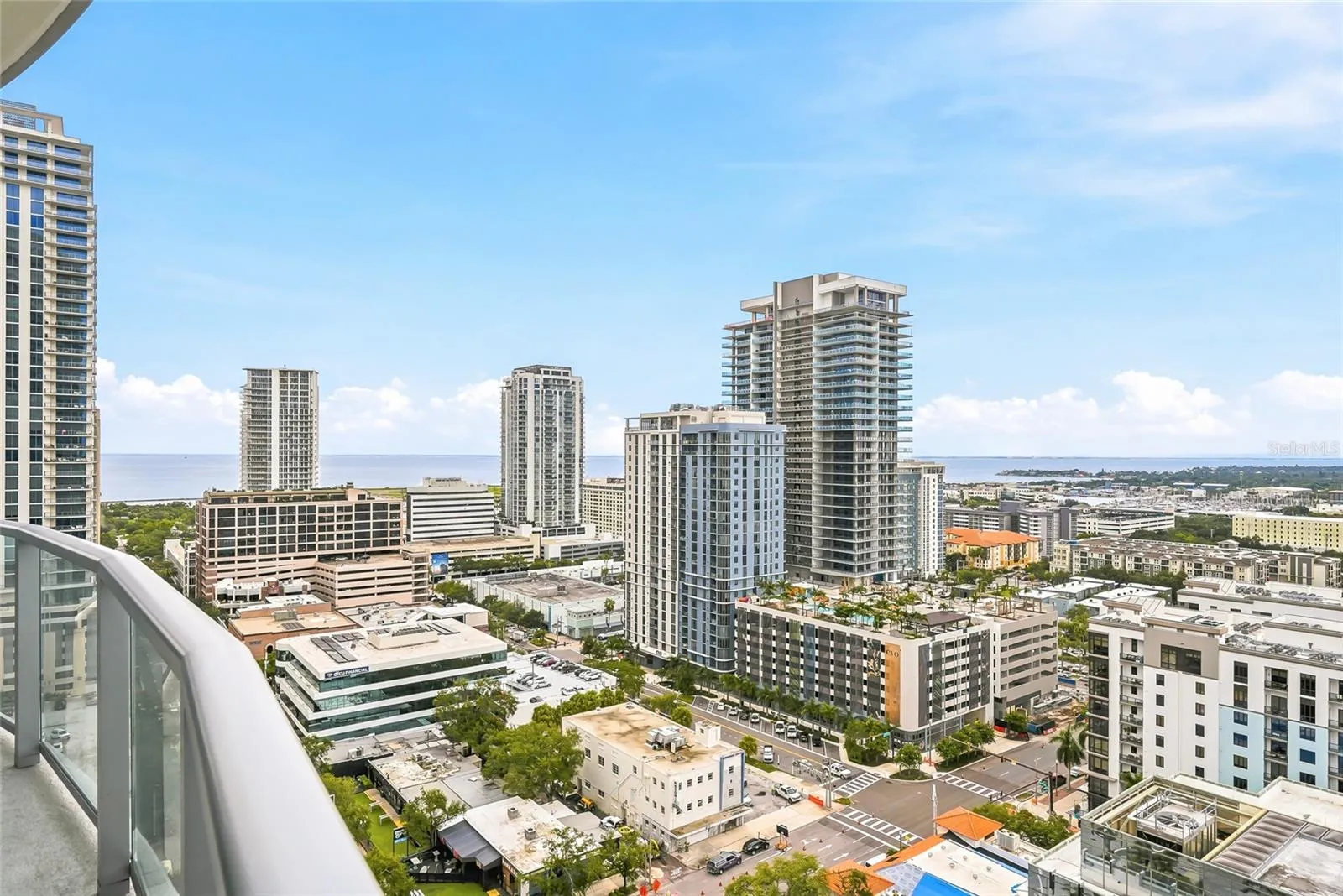 Beautiful water and city views from the primary bedroom’s private terrace.