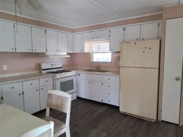 Kitchen with gas range and eat in space