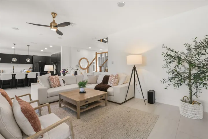 This inviting family room opens directly to the kitchen, offering seamless flow for entertaining and daily living.
