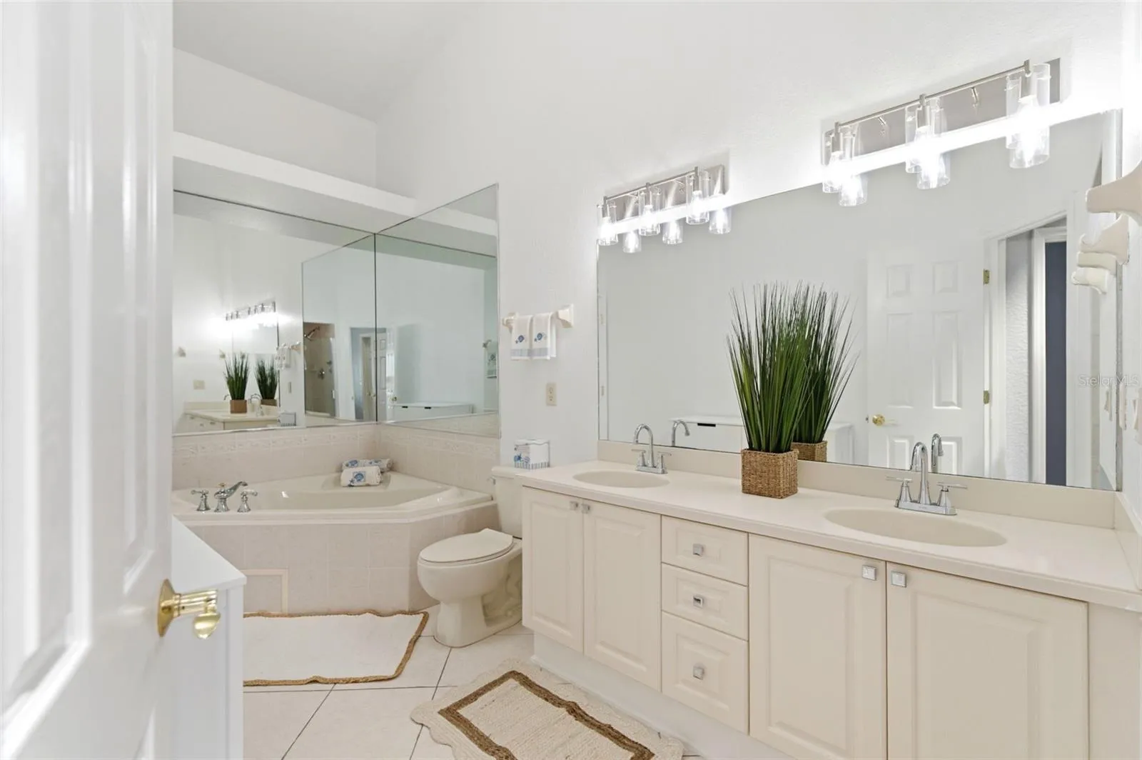 Primary bath with bath tub as well as a huge walk in shower