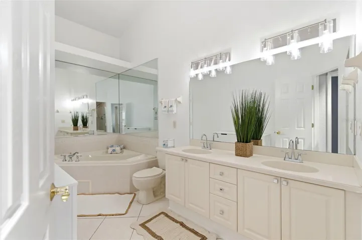 Primary bath with bath tub as well as a huge walk in shower