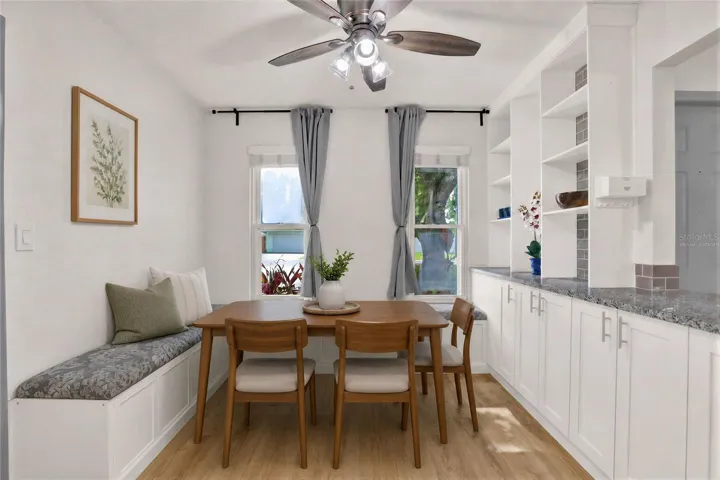 Virtually staged: Eat-in space with cushioned benches built in.