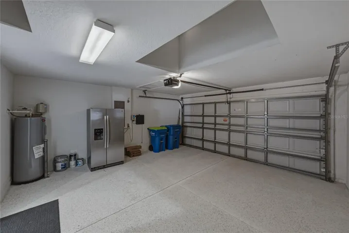 Garage with Extra Garage Refrigerator and Epoxy Floors