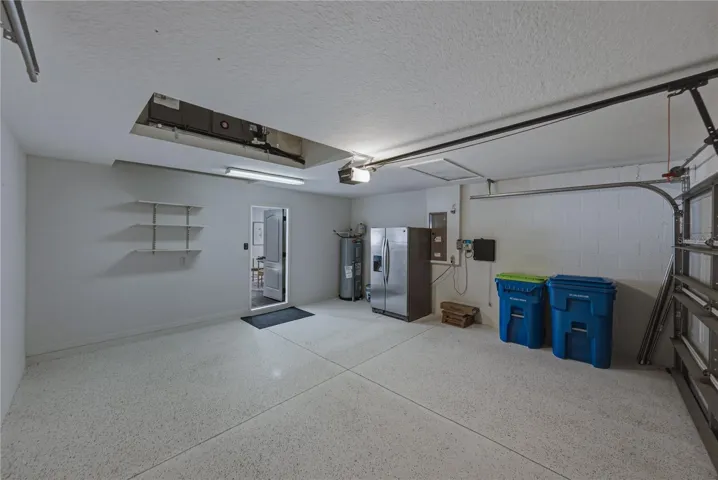 Garage with Extra Garage Refrigerator and Epoxy Floors