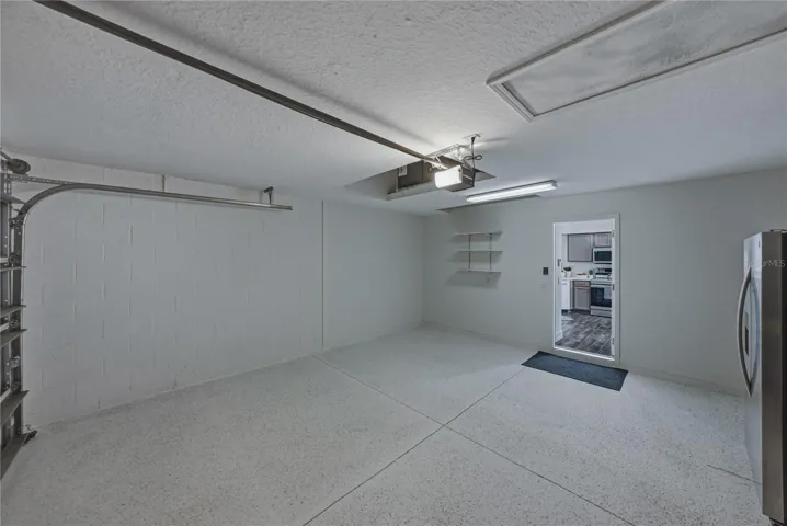 Garage with Extra Garage Refrigerator and Epoxy Floors
