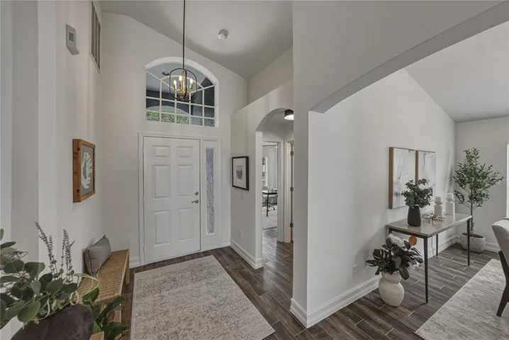 Foyer has a nice mudroom area and additional space for a foyer table.