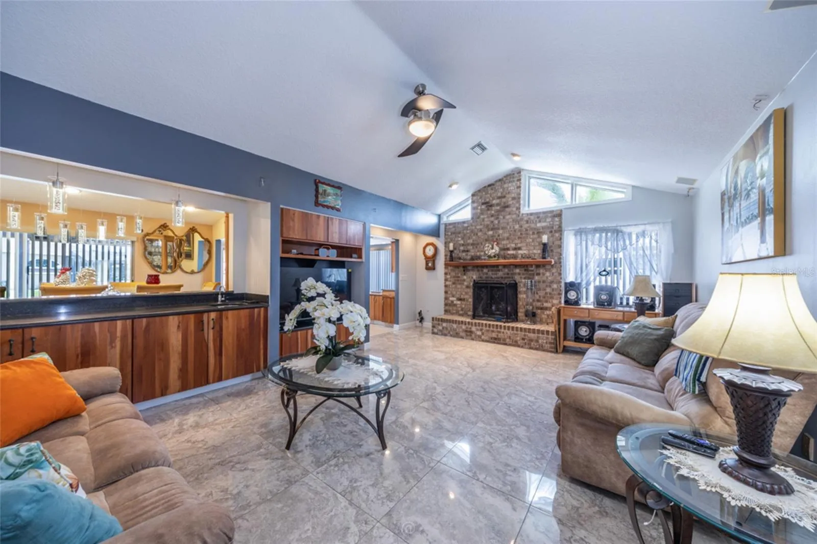 Wood Burning Brick Fireplace In The Den