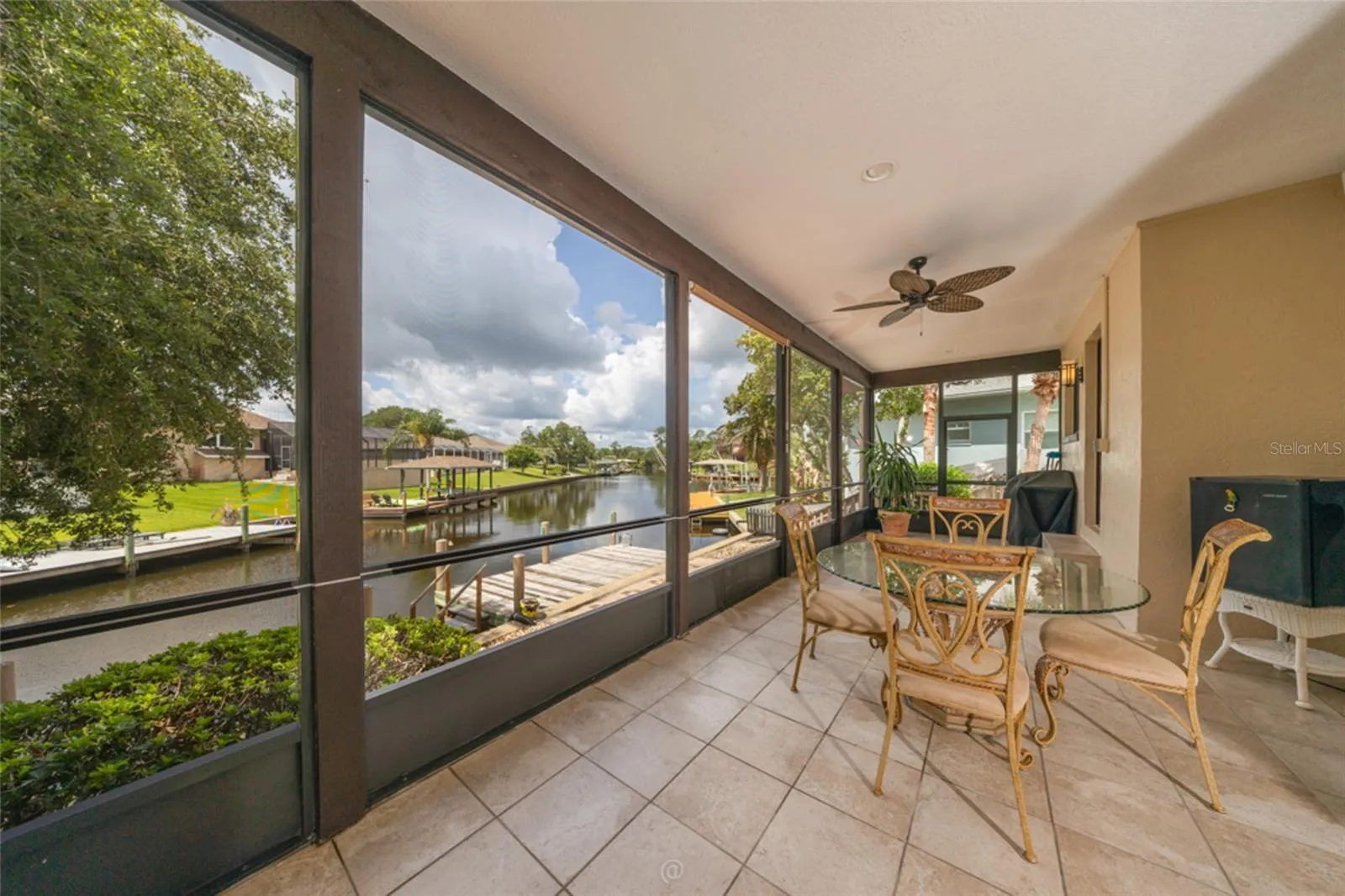 Large 471 Sq Ft Screened and Tiled Lanai With Views Down The Canal