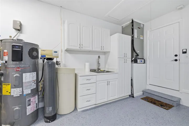 Hybrid Hot Water Heater that is energy efficient and outputs cold AC to the Garage! Culligan Water Softener! Quartz Counters with storage Cabinetry! AC is a TRANE with a Clean Effects Filter!