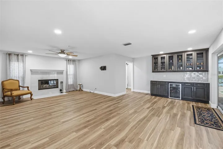 Large Great Room offers seating options that makes sense! The Fireplace has Travertine Tile! Love this feature when we get those chilly days!