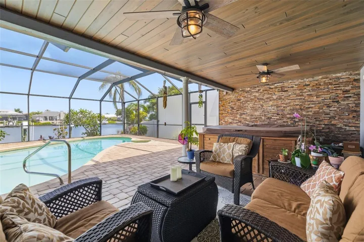 Very inviting Entertainment Area with DeGeorge Wood Ceiling! Yes that quality Matters as the boards are coated on all sides to protect its Longevity!  Hot Tub is an amazing feature!